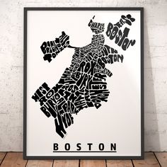 a black and white poster with the word boston in it's center, on a wooden floor