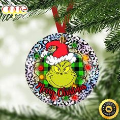 an ornament hanging from a christmas tree with the words merry christmas on it