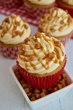 cupcakes with white frosting and caramel drizzle on top