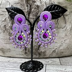 Description: Statement Soutache Earrings, These Items Are Individually Made With Love By Me. Details: Handmade Item These Trendy Soutache Earrings Are 100% Handmade And Have One-Of-A-Kind Designs. Color: Red Material: Viscose Cords & Beads Metal: Stainless Steal Dimensions: 2" X 1" Style: Elegant/ Boho Chic / Stylish/ Art Deco Care Instructions: Store Out Of Direct Sunlight And Keep Away From Water. It Is Not Recommended To Wear These Earrings In Or Around Water. Handmade Purple Chandelier Earrings For Party, Stylish Art, Soutache Earrings, Stainless Steal, Stylish Earring, Style Elegant, Date Night, Boho Chic, With Love