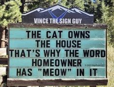 a sign that says the cat owns the house that's why the word homeowner has meow in it