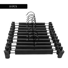 a set of black racks with hooks on each one side and two rows of clips in the middle