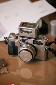 a silver camera sitting on top of a table