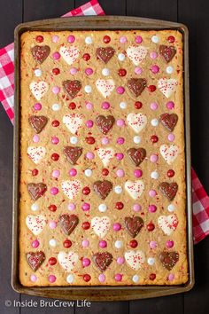 a cookie with hearts on it in a pan