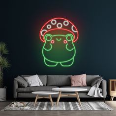 a living room with a couch, coffee table and neon sign that says totoro