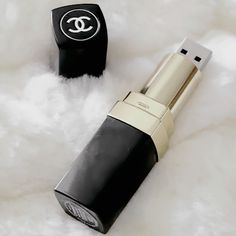 chanel lipstick and lighter on white fur