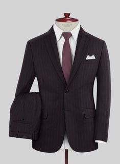 Refine your wardrobe with the luxurious style of Lanificio Zegna's Trofeo Dexi Dark Maroon Stripe Wool Suit. Crafted from pure wool with a subtle stripe weave pattern in a deep maroon hue, it exudes a beautiful air of sophistication. So enjoy the exquisite comfort of this premium piece and feel the envy of others as you make a modern mark on any occasion.   Look Includes     Lanificio   Zegna  Trofeo Dexi Dark Maroon  Stripe   Wool   Fabric  Two Button Jacket Style  Notch Lapel   Horn Royal Bla Elegant Business Suit In Suiting Fabric, Elegant Business Unstitched Suit In Suiting Fabric, Elegant Unstitched Business Suit, Elegant Unstitched Business Suit In Suiting Fabric, Tailored Designer Business Sets, Designer Tailored Business Sets, Designer Tailored Sets For Business, Elegant Formal Silk Unstitched Suit, Elegant Silk Unstitched Suit For Formal Occasions