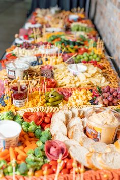 a table filled with lots of food and condiments on top of each other