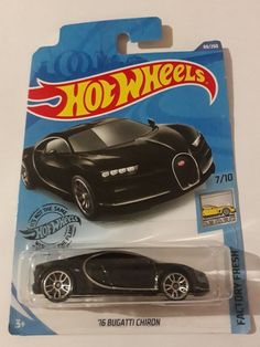 the black bugatti chiron hot wheels car is on display in front of a white background