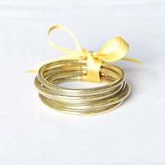 Add accessories to your outfit without the noise :) NEW jelly bangle sets! Includes 5 bangles in each set. Glitter and sequin filled. Gold Bracelet Stack, Jelly Bracelets, Tube Bracelet, Bracelet Stacks, Bangle Bracelet Set, Golden Glitter, Stacked Bangles, Exclusive Gift, Dark Gold