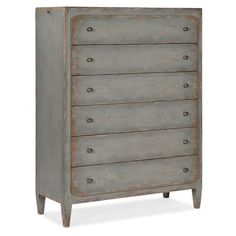 an old gray dresser with five drawers