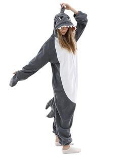 a girl in a shark costume is posing for the camera