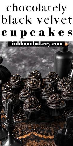 chocolate cupcakes with black velvet icing and gold sprinkles