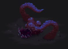 an octopus with its mouth open in the dark