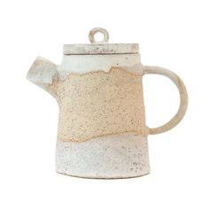 a white and brown ceramic tea pot with a handle on it's side, isolated against a white background