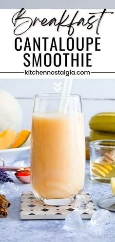 a smoothie in a glass next to bananas and other ingredients