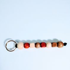 a row of beads sitting on top of a keychain