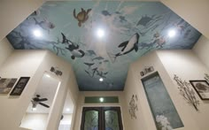 the ceiling is painted with an underwater scene