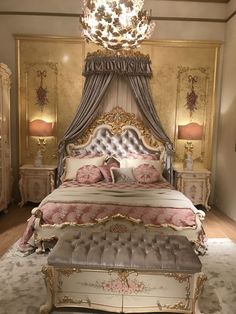 a fancy bedroom with an ornate bed and chandelier