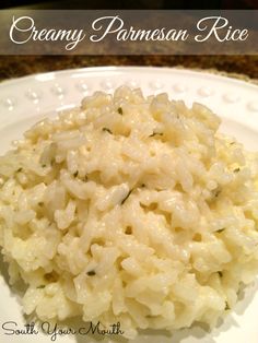 a close up of a plate of food with rice and parmesan cheese on it