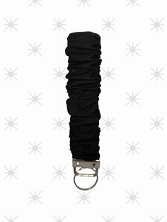 a black umbrella is hanging from a hook on a white background with starbursts