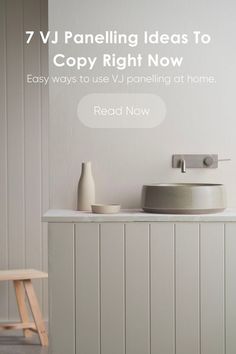 a white bathroom sink sitting on top of a counter