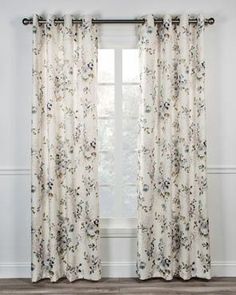 the curtains in this room are decorated with pink flowers