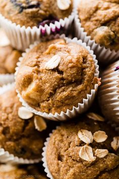 muffins piled on top of each other with oats and blueberries in them