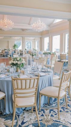 an elegant banquet room with blue and white decor