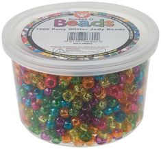 beads in a plastic container filled with multicolored bead mix on a white background