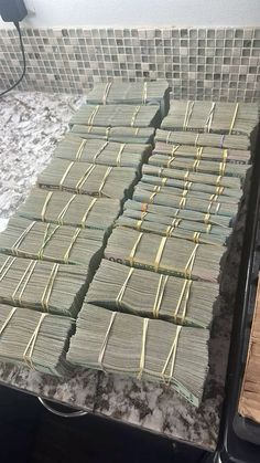 stacks of money sitting on top of a counter