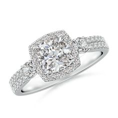 a cushion cut diamond ring with double halos