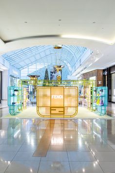 an empty shopping mall with the end sign lit up