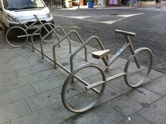 there is a bike rack on the sidewalk