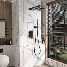 a bathroom with a toilet, shower head and window in the wall next to it