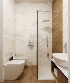 a bathroom with a toilet, sink and bathtub next to a stand up shower