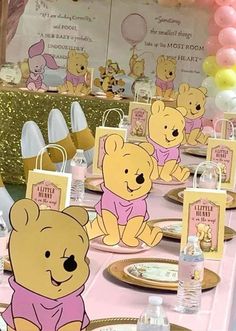 winnie the pooh themed birthday party with pink and gold decorations, balloons and teddy bears