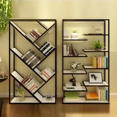 two shelving units with books on them in a room next to a table and lamp