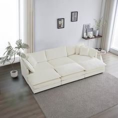 a large white sectional sofa in a living room