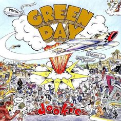 an advertisement for the green day in front of a large group of people and planes