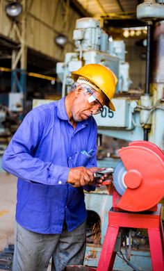 a man in a hard hat working on something