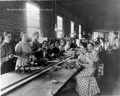 an old black and white photo of women working in a factory