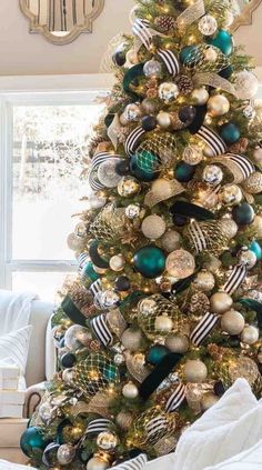 a christmas tree decorated with gold and green ornaments