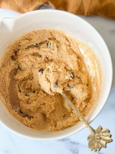 a white bowl filled with peanut butter and chocolate chips