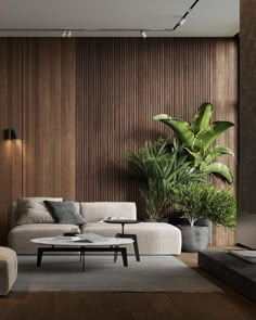 a modern living room with wood paneling and plants on the wall behind the couch