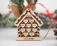 a wooden ornament hanging from a christmas tree