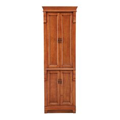 a tall wooden cabinet sitting on top of a white wall