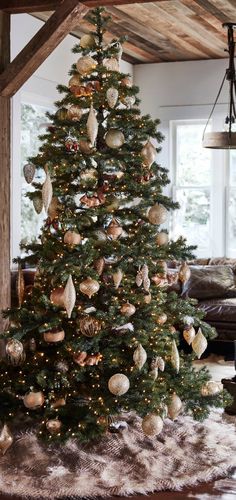 a decorated christmas tree in a living room