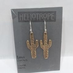 Heliotrope Artisan-Crafted Dangle Earrings. Brass Stamped Cactus On French Hook Backs. Brand New On Card, About 1.5" Long. Cactus Earrings, Handcrafted Artisan Jewelry, Brass Color, Artisan Jewelry, Jewelry Watches, Cactus, Dangle Earrings, Brass, Jewelry Earrings