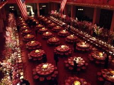 an overhead view of tables and chairs with american flags in the background